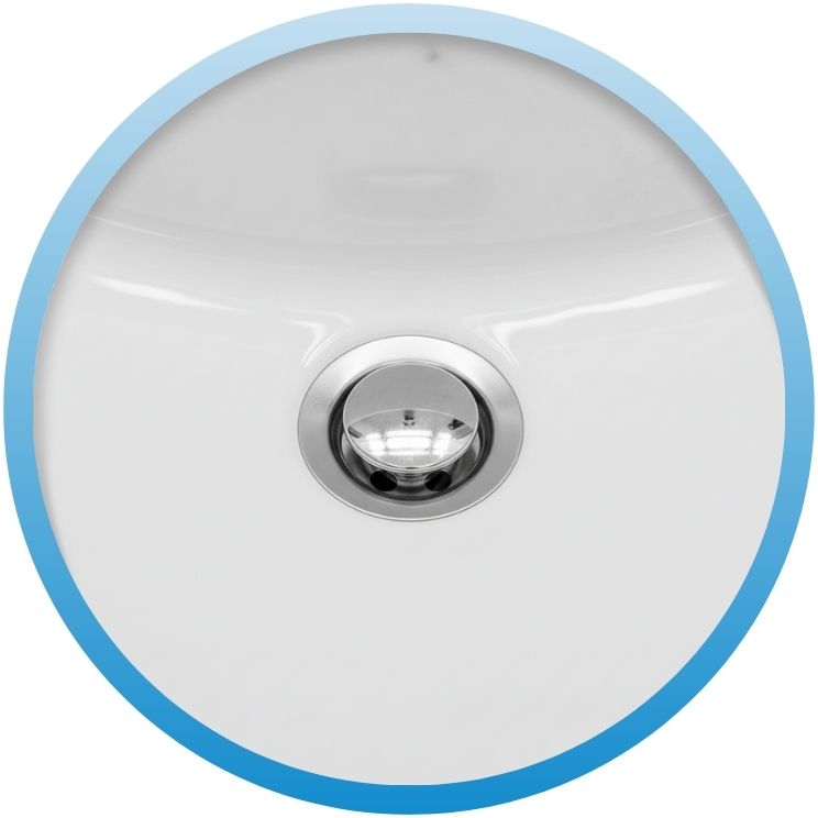 Top-down view of a newly installed chrome sink drain.