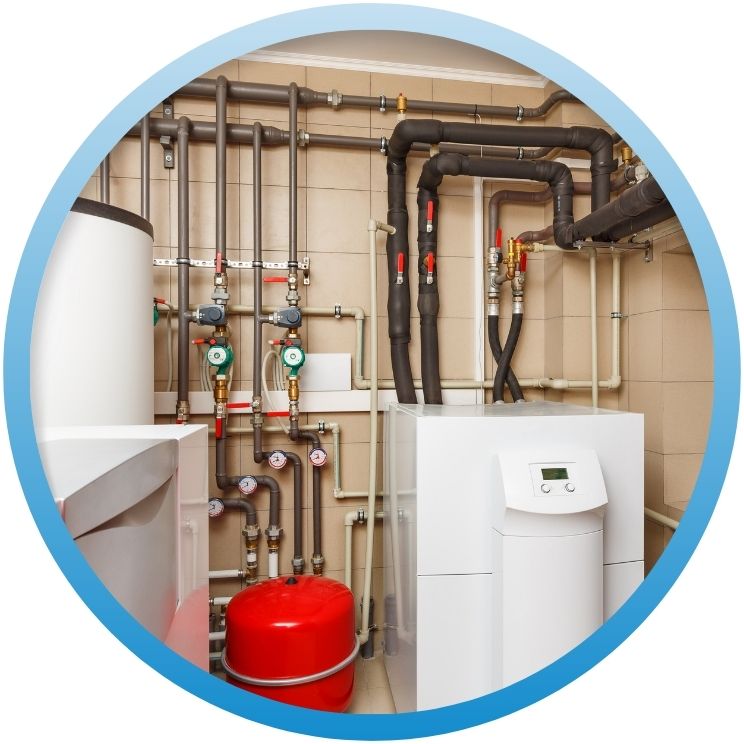 Modern mechanical room with boiler, expansion tank, and piping.