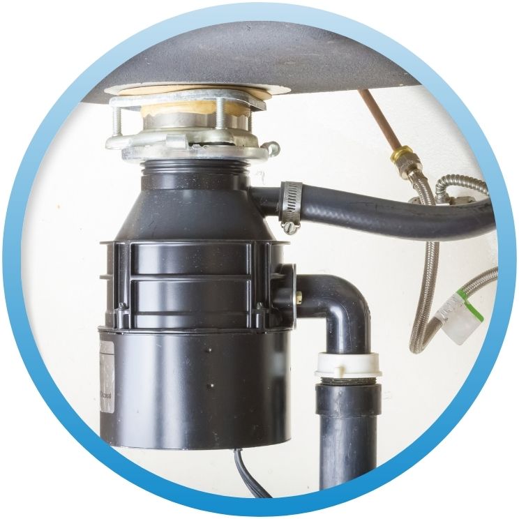 Black garbage disposal unit installed under a kitchen sink.