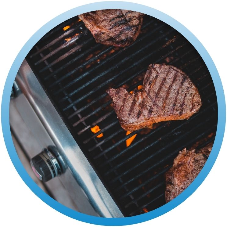 grill with steaks