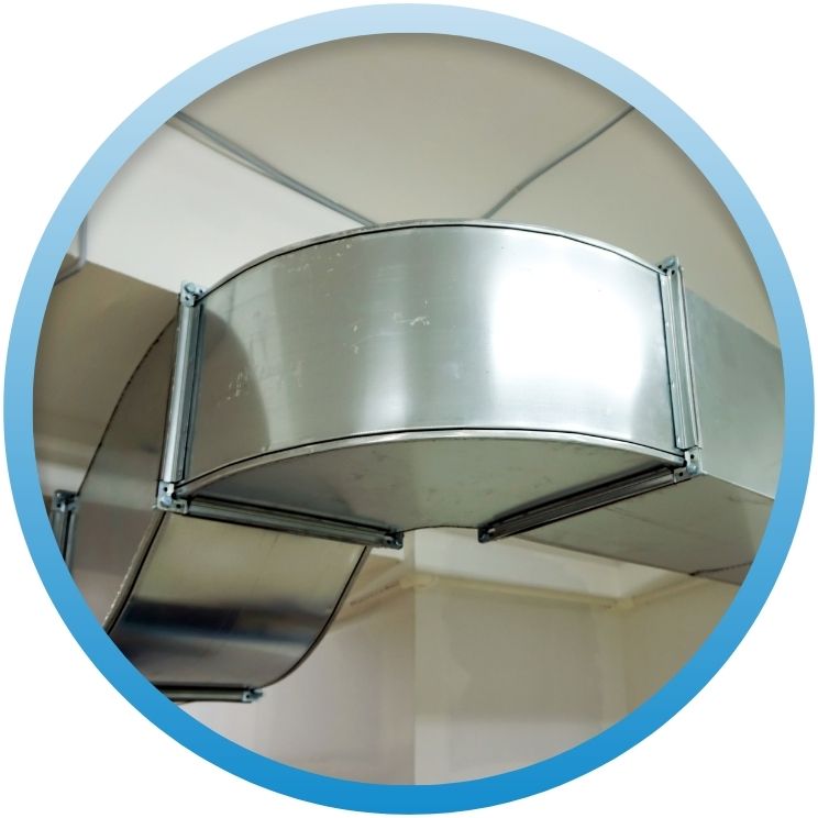 Close-up of clean metal HVAC ductwork in a building.