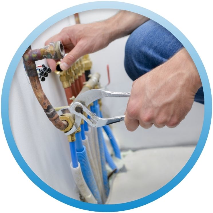 pliers to tighten a manifold pipe connection radiant heating