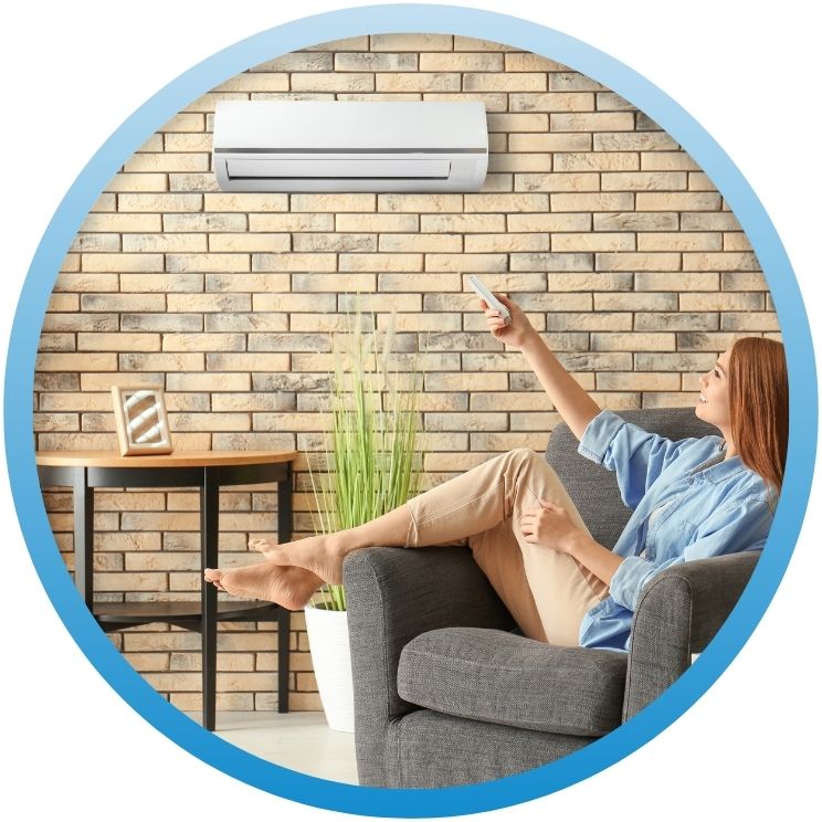 woman using remote for her mini split system