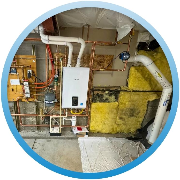 Wall-mounted high-efficiency boiler with complex copper manifolding.