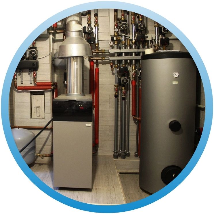 Modern boiler room with water heater and complex piping.