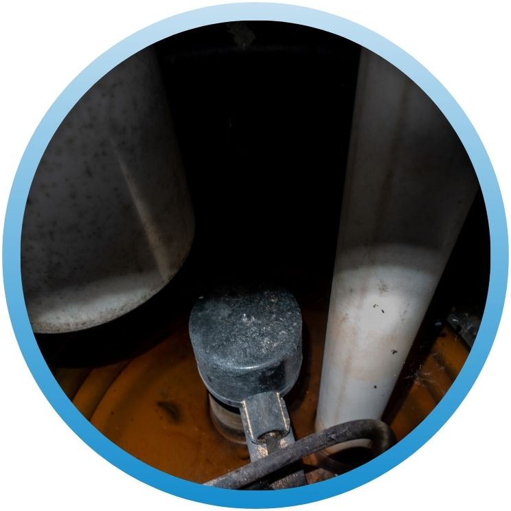 Interior view of a sump pump basin with float switch.