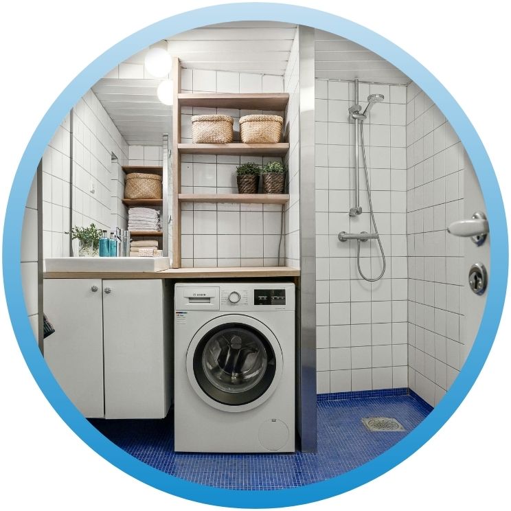 laundry room and shower area with tiled flooring.