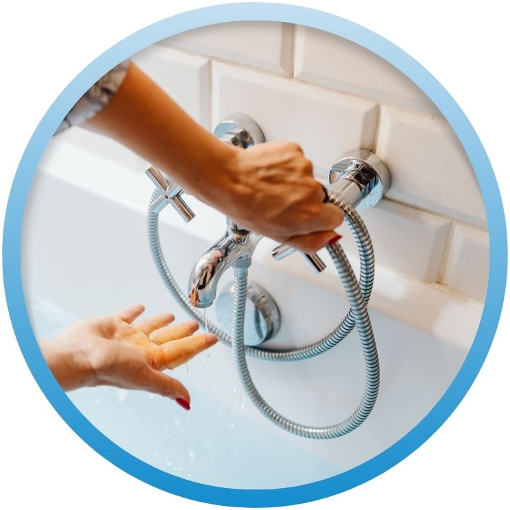 woman feeling water temperature