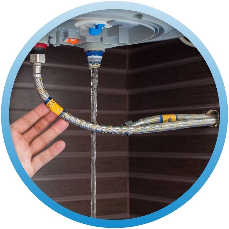 Water leaking from a loose braided stainless steel hose.